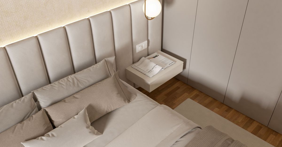 A stylish and modern bedroom interior featuring luxury bedding and contemporary design elements.