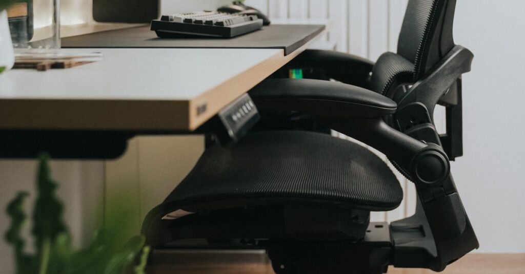 Sleek home office featuring an ergonomic chair near a minimalist desk setup.