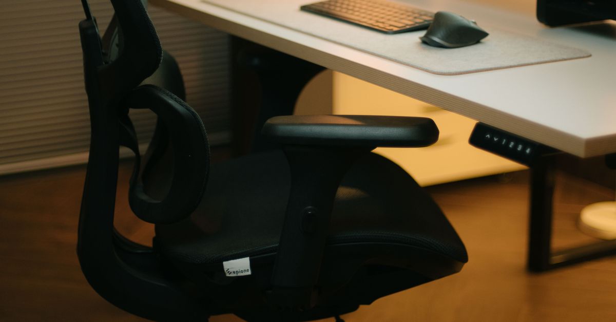 Stylish home office with ergonomic chair and modern desk setup for productivity.