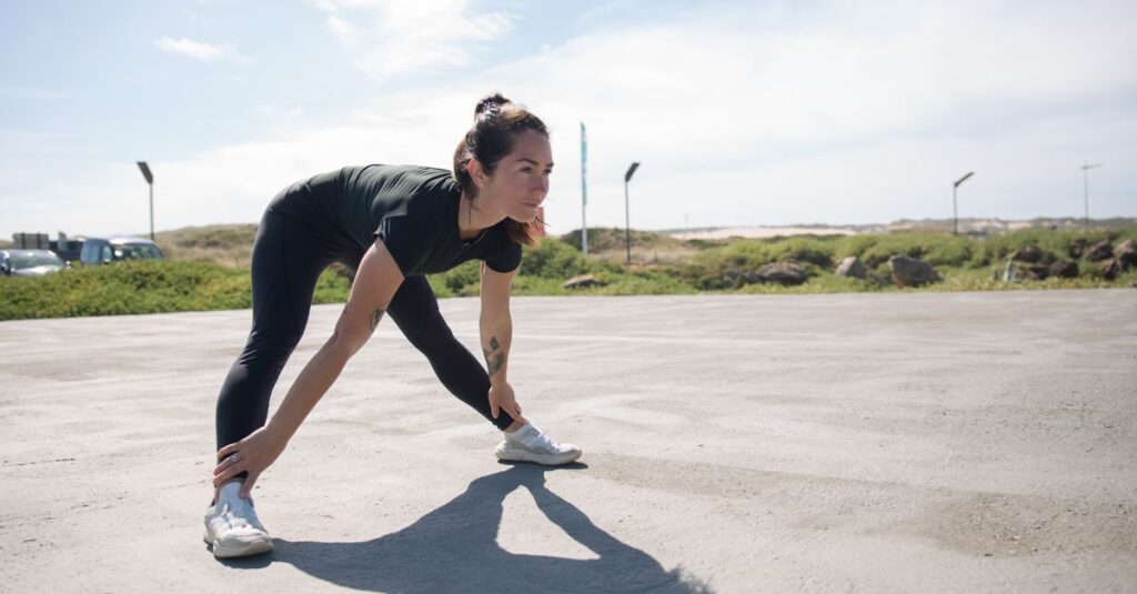 A youthful woman stretching on a sunny day in a scenic Portugal park, showcasing fitness and vitality.